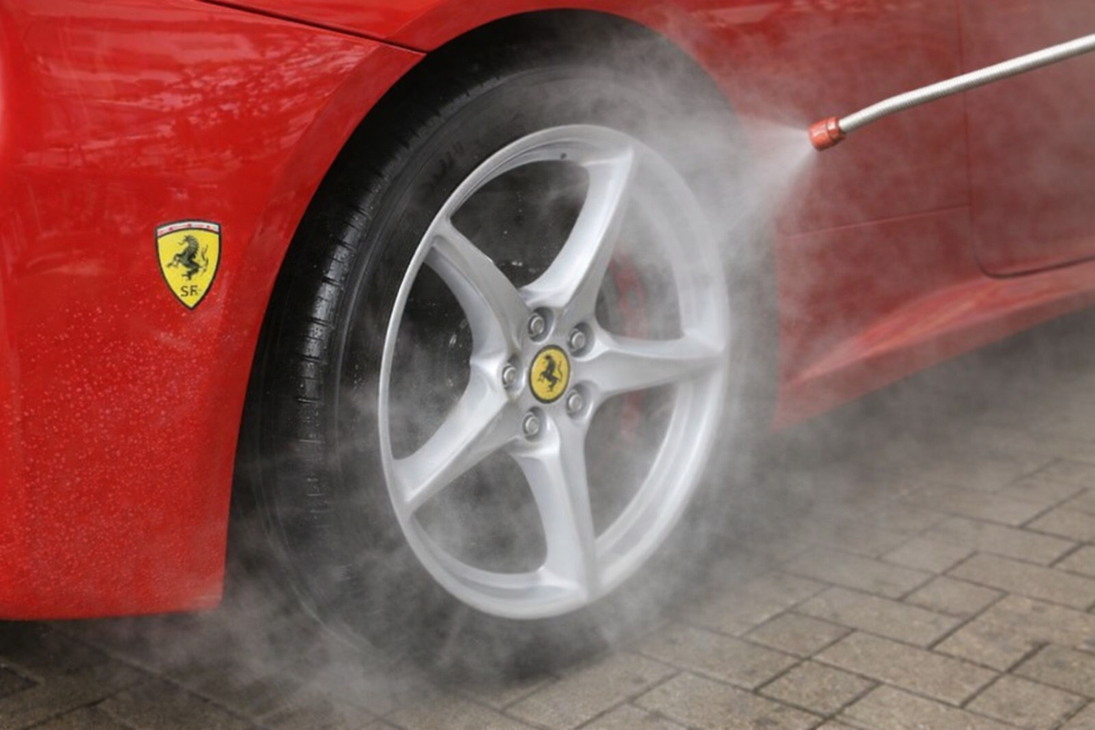 Car wheel cleaning with fine spray